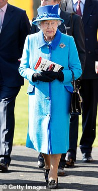 Queen Elizabeth II, dressed in sky blue, celebrates her 91st birthday at the Dubai Duty Free Spring Trials Meeting at Newbury Racecourse on April 22, 2017