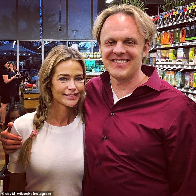 Wilcock was a leading figure in the UFO 'disclosure movement,' which advocates for releasing alleged government secrets about extraterrestrials. Wilcock is pictured with actor Denise Richards