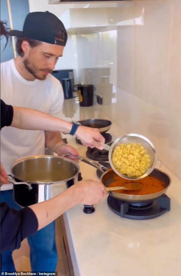 It took both Brooklyn and his friend Zah to naviagte tipping the cooked pasta into the sauce pan