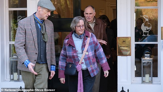 Jane is presented with her on her 66th birthday - some 26 years later than husband Stephen (background) had promised to have it ready