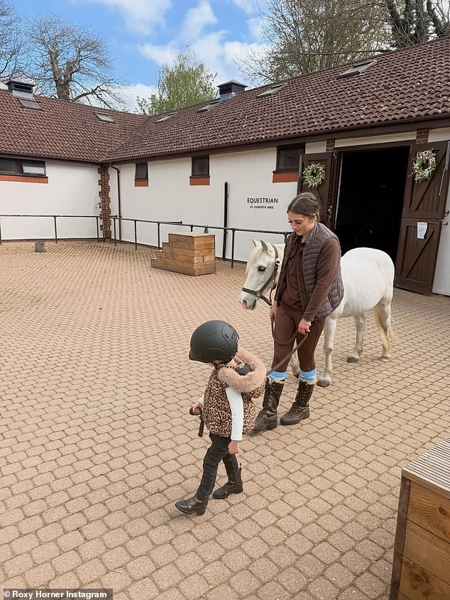 Roxy also gushed that 'Elsie even got to meet a horse called Roxy!' as the toddler was pictured leading her new friend out of her stables