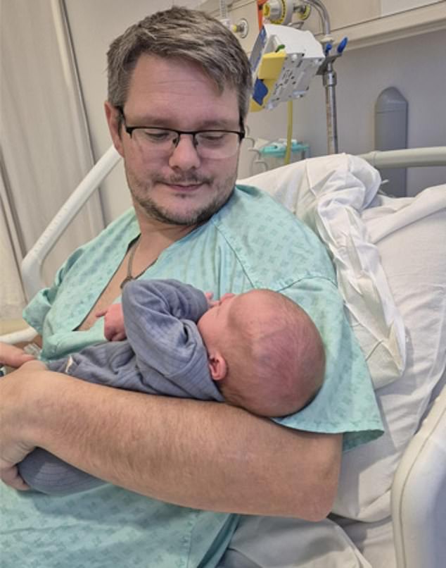 Chris is seen holding his newborn nephew as he lies in a hospital bed during his battle with cancer