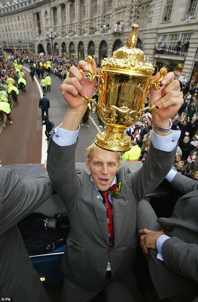 Moody celebrates winning the 2003 World Cup on an open-top bus parade in London