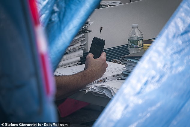 Investigators looking through documents that Heuermann had hidden as he carried out his kills