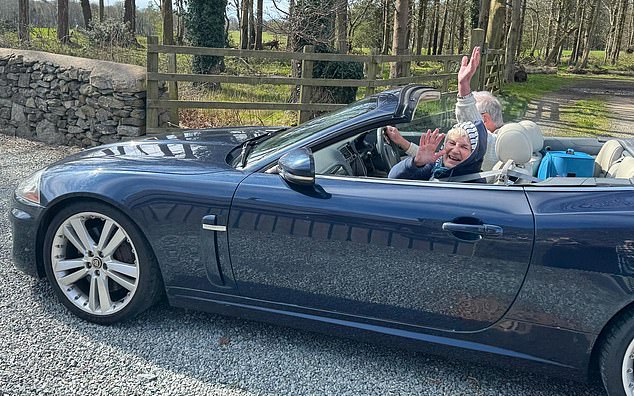 James Anderson, 82, is pictured in his 2010 Jaguar XK with his wife. He says he is forced to SORN it over the winter months to evade the £790-a-year VED sting