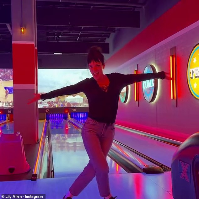 Enjoying downtime while not on stage she headed to a bowling alley