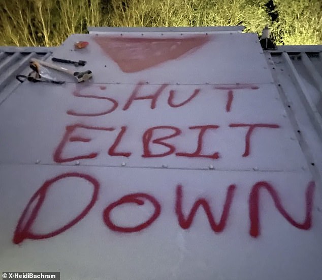 Activists have spray-painted the words 'Shut Elbit down', alongside a red upside triangle - a symbol widely used in Hamas propaganda videos to denote Israeli military targets