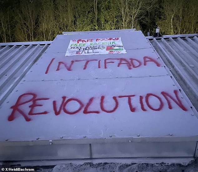 The group have also daubed the words 'Intifada Revolution' onto the roof and a poster stating 'Free Palestine', alongside a Palestinian flag