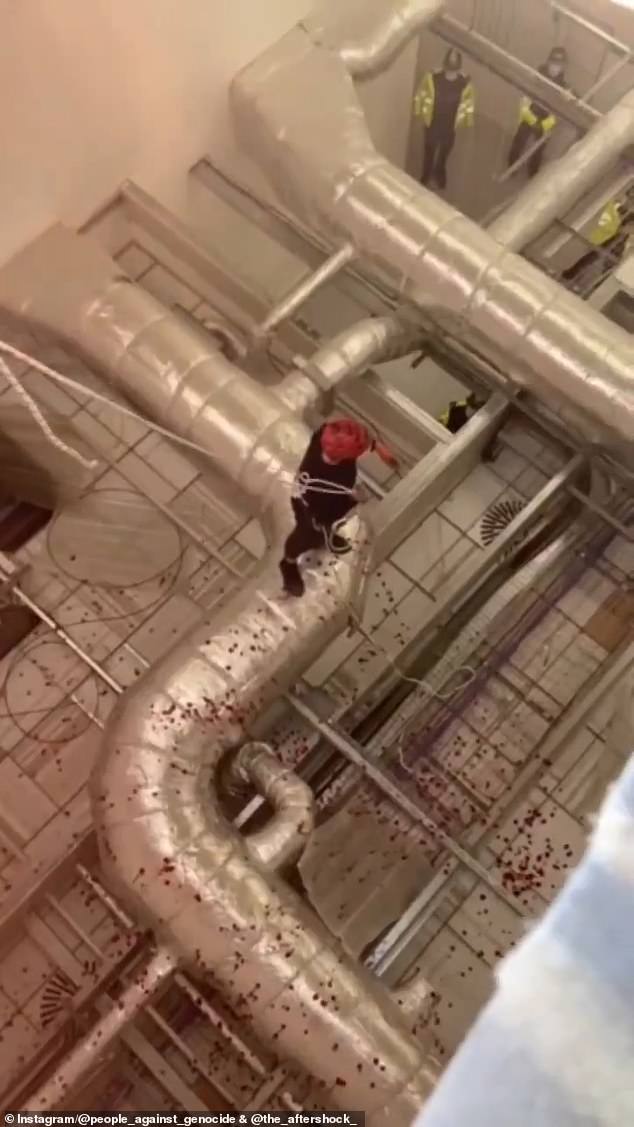 Some of the activists audaciously abseiled into the building and smashed equipment within the factory while hanging from the ropes