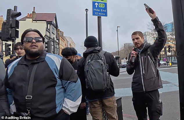The officer was surrounded by a group of men angry about the man (pictured right) preaching from the Bible in Whitechapel, but she told them: 'In this country, we have freedom of speech'