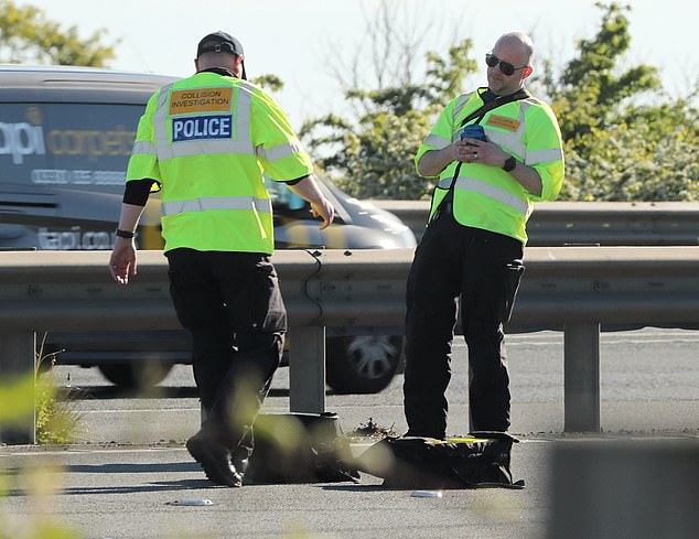 The woman, from Canvey Island, Essex, was arrested at the scene (pictured) on suspicion of failing to provide a sample of breath. She remains in custody