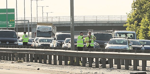 Surrounding traffic can be seen (pictured) at a near standstill - which saw drivers warned of delays in the area