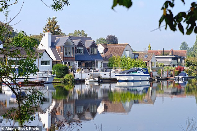 A picturesque vista of the River Thames flowing through Laleham on an early autumn day