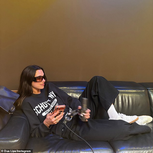 Dua was also seen lounging on a leather sofa in a casual ensemble with a microphone in her hand as she got to recording