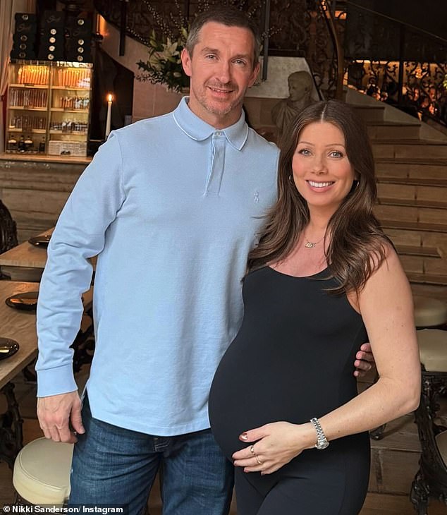 Taking to Instagram on Saturday, Nikki shared a picture of her and Anthony's son, whose name she is yet to reveal, with the words: 'Hello world' (Nikki and Anthony pictured)