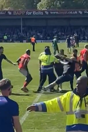 The Rochdale fan was knocked backwards to the floor after being struck