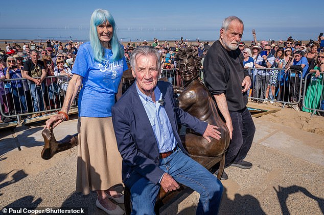 Thousands gathered (pictured) to watch the sculpture's unveiling at the weekend