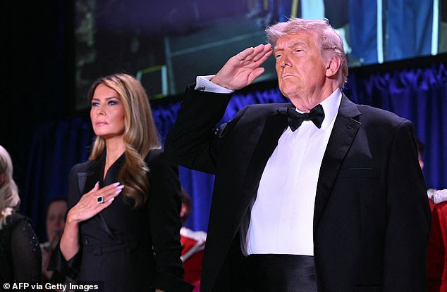 President Donald Trump and First Lady Melania Trump were both rushed off stage from the White House Correspondents' Dinner after gunshots were heard inside the Washington Hilton. They are seen during the National Anthem