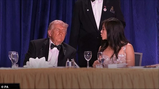 The President was seated at the head of the table on stage when the incident occured