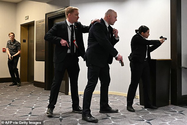 Secret Service agents ready to spring into action. One of their own was the lone victim of the shooting, though he was protected by his bulletproof vest