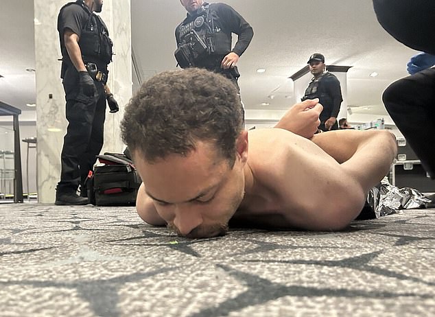 President Trump shared this dramatic image of the shirtless alleged shooter after he was taken down by law enforcement