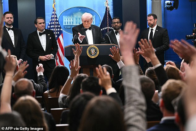 Most reporters had rushed over from the Hilton hotel which was hosting the dinner just over one mile away, with many still wearing their black tie and ball gowns from the ritzy gala