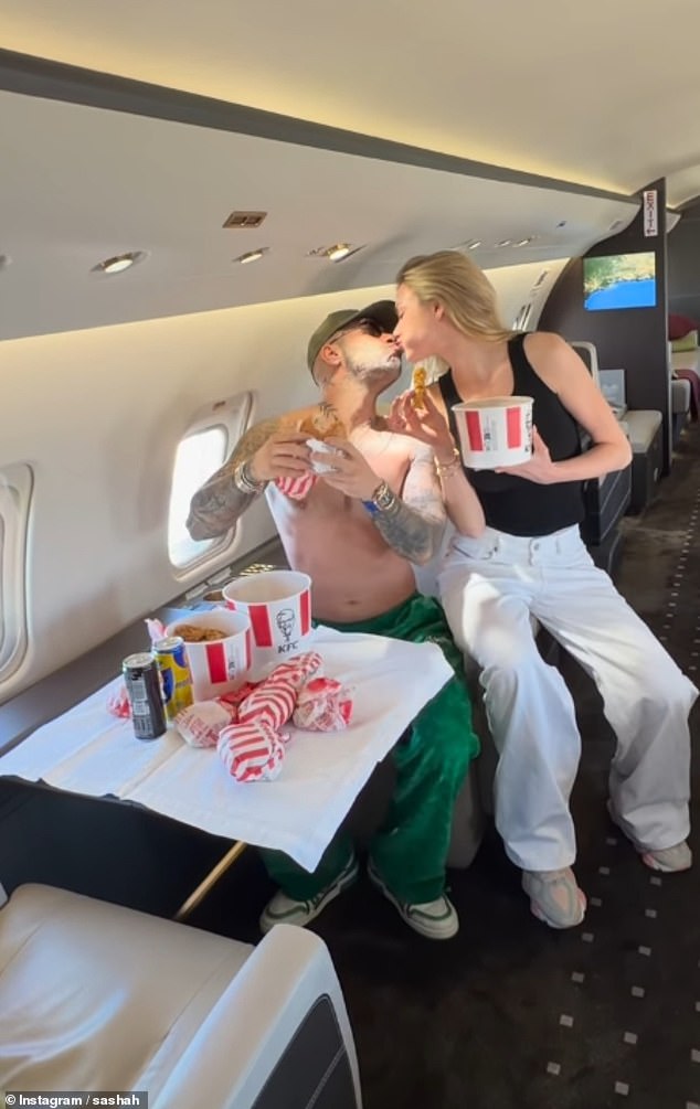 Picture shows Sobhani and Neimas onboard a private jet as they tuck into fast food