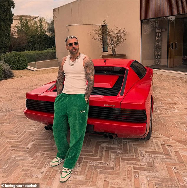 He is reportedly wanted in Iran on charges including money laundering and running illegal gambling operations, which he denies. He is pictured here posing with a sports car
