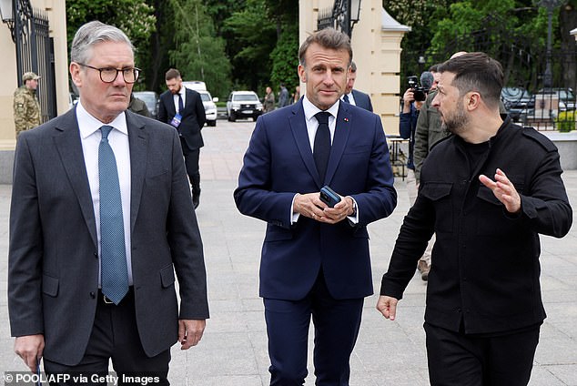 Left to right: Sir Keir Starmer, Emmanuel Macron and Volodymyr Zelensky in the grounds of the Mariynsky Palace in Kyiv