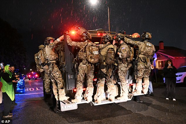 FBI officers leave the scene after responding to an address connected to Allen