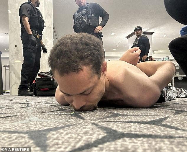 He was tackled to the ground and placed in handcuffs after charging past a security checkpoint inside the hotel