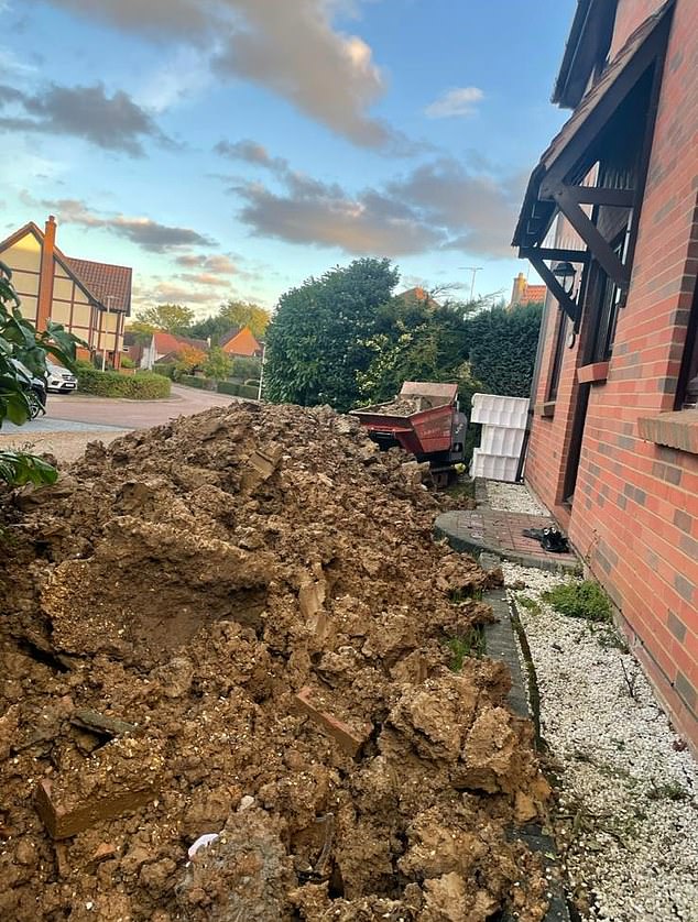 Piles of earth and bricks outside the Davies' four-bedroom detached house in Basildon, Essex