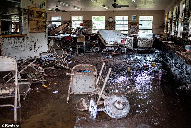 Furniture and debris lie scattered inside a cabin at Camp Mystic after deadly flooding in Kerr County, Texas