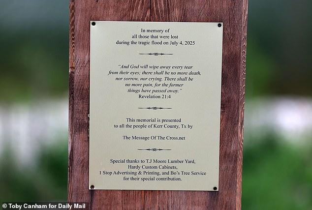 A memorial plaque bearing a biblical verse honors the victims of the tragedy