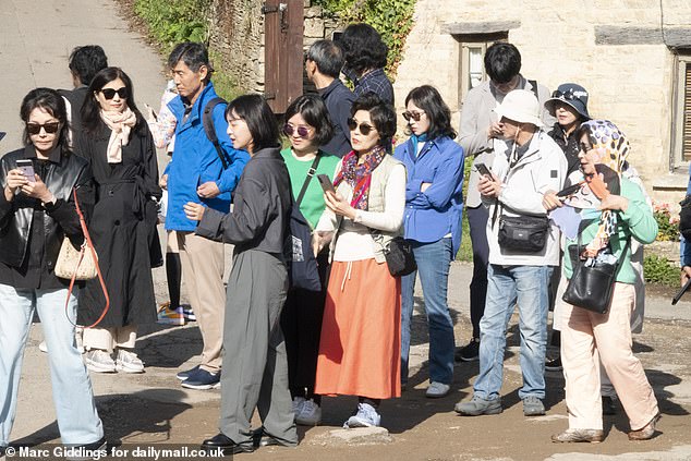 Tourists head to Bibury in Gloucestershire, which has become popular with Chinese visitors
