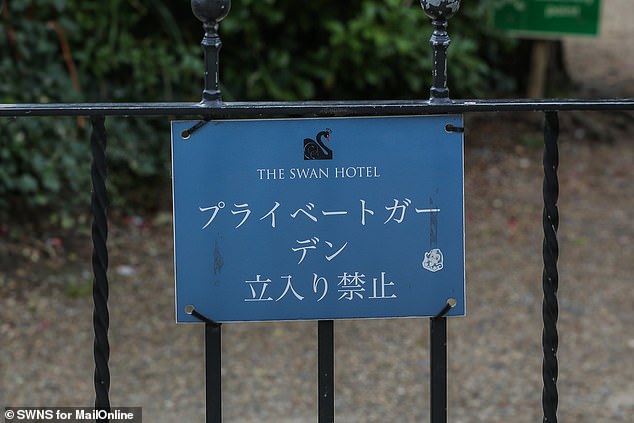 One sign in Japanese outside The Swan Hotel in Bibury reads 'private gardens are off limits'