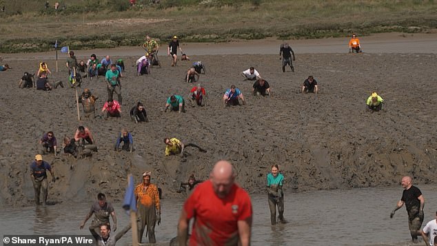 Participants ran, walked and crawled as they clambered through the thick mud and across the riverbed