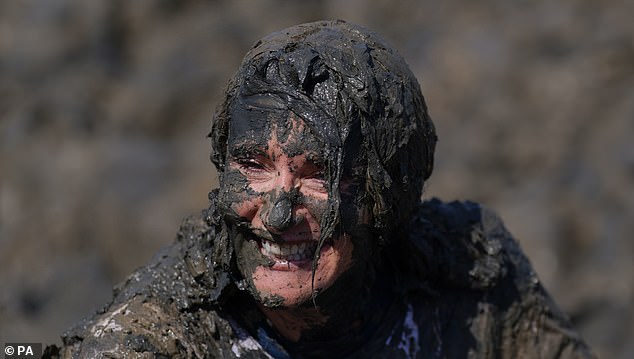 One competitor looked like she had a mud mask after making her way through the river