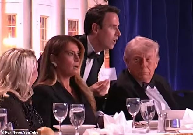 First Lady Melania Trump is pictured looking shocked just before the dinner descended into chaos