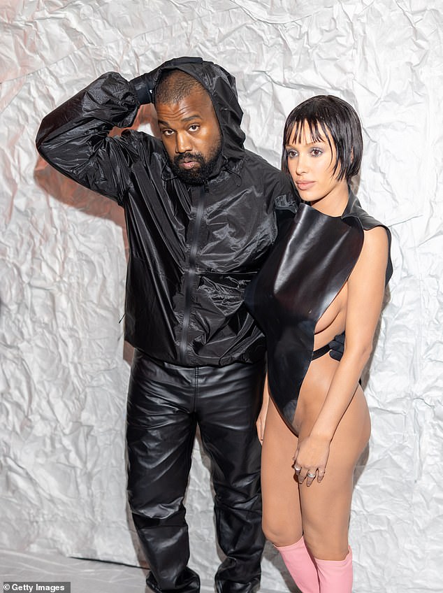 His wife has stuck closely by his side amid the backlash for his past comments and his attempt at making a comeback; pictured in February 2024