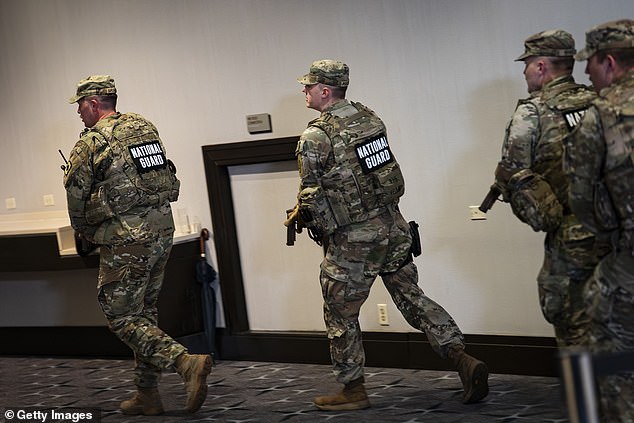 Allen wrote that national guardsmen would only be targets if they fired at him first. Members of the National Guard are pictured responding to the shooting