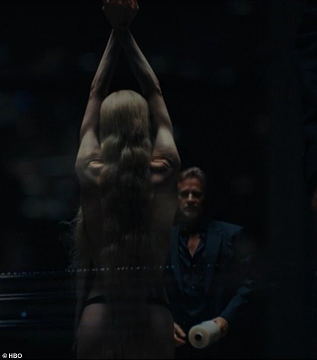 Earlier in the episode Jules stood naked aside from a black thong with her arms raised in the air as a married doctor wrapped her entire body and head with cellophane so she could not move