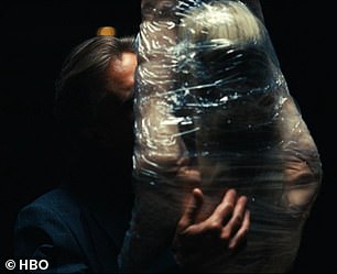 The fully-clothed doctor left only her mouth uncovered so he could kiss her