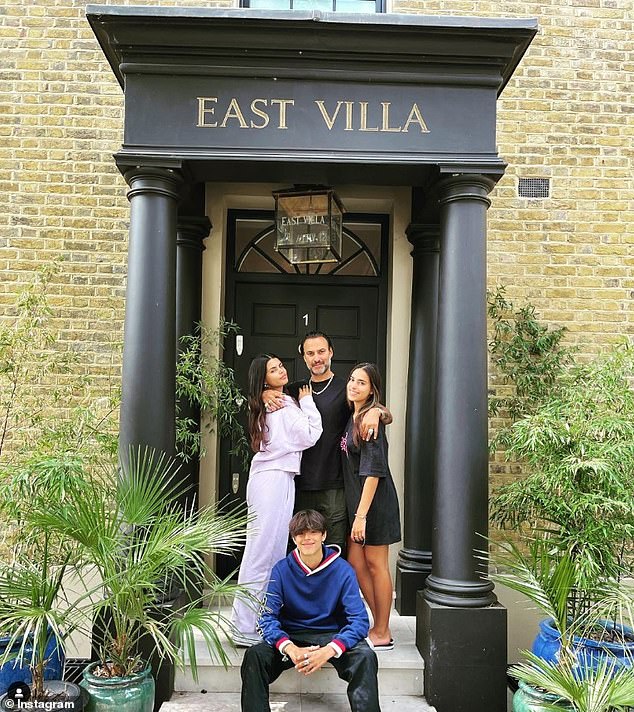 Issy pictured with her father and siblings Freya and Jesse outside their stunning London home