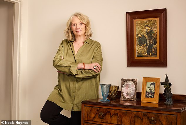 We kick off in the hallway where I have a wall of black and white prints. Katie points out that most of them show women on their own. Or animals, also on their own