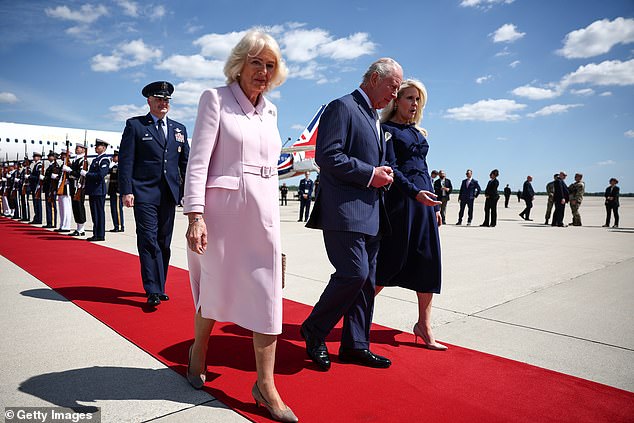 King Charles III and Queen Camilla are greeted by US Protocol Chief Monica Crowley (R) as they arrive on day one of their State Visit to the United States today