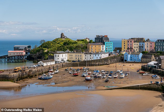 Tenby Harbour offers a scenic sandy beah, colourful hourses and views of Carmarthen Bay