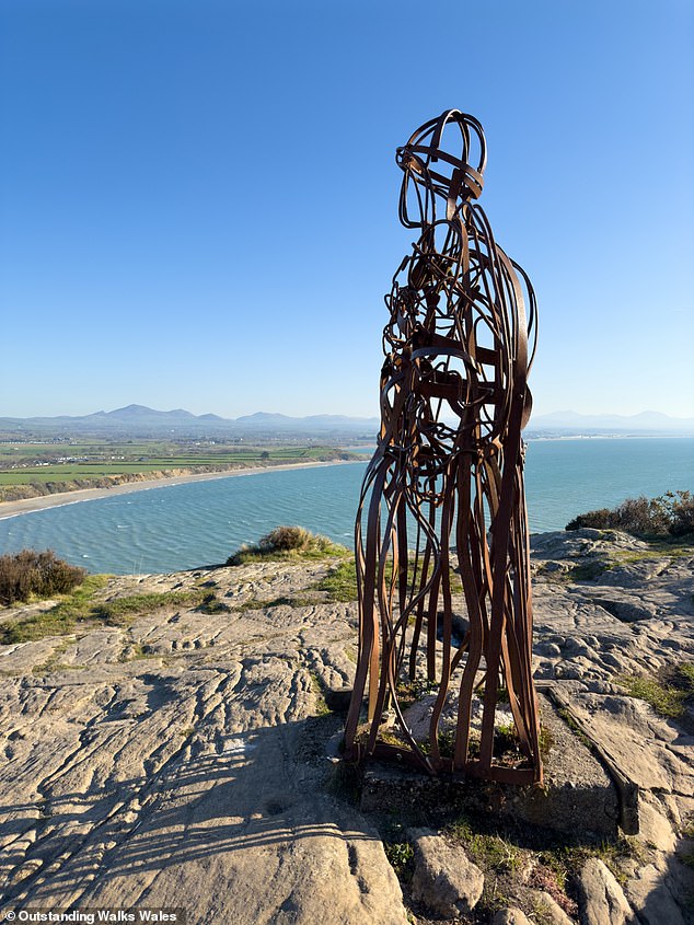 The Tin Man is an iconic artwork that stands over Llanbedrog Beach