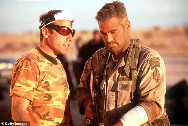 Russell famously clashed with star George Clooney on the set of Three Kings (1999), and Clooney later branded the director 'a miserable f***'; seen together on the Three Kings set