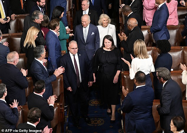 The King received a four-minute standing ovation as he walked into the packed chamber before he had even said a word